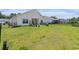 Spacious fenced backyard with covered patio, grill, and lush green lawn at 227 Palm Terrace Loop, Conway, SC 29526