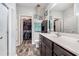 Spacious bathroom featuring a walk-in closet and double sinks with granite countertops at 227 Palm Terrace Loop, Conway, SC 29526