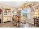 Traditional dining room features a wood table, elegant chandelier, and a decorative wall shelf at 227 Palm Terrace Loop, Conway, SC 29526