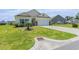 Well-maintained front yard of a charming home, showcasing a lush green lawn at 227 Palm Terrace Loop, Conway, SC 29526