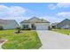 Charming single-story home with a well-manicured lawn and a two-car garage at 227 Palm Terrace Loop, Conway, SC 29526