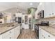 Spacious kitchen with stainless steel appliances, granite countertops and ample cabinet space at 227 Palm Terrace Loop, Conway, SC 29526