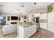 Open concept kitchen with granite counters, stainless appliances, and a breakfast bar overlooking the living area at 227 Palm Terrace Loop, Conway, SC 29526
