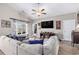 Spacious living room with vaulted ceilings, modern ceiling fan, and comfortable sectional sofa at 227 Palm Terrace Loop, Conway, SC 29526