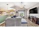 Open-concept living room with hardwood flooring, a cozy fireplace, and natural light from the window at 227 Palm Terrace Loop, Conway, SC 29526