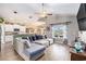 Open-concept living room flowing to kitchen and dining area with hardwood floors and recessed lighting at 227 Palm Terrace Loop, Conway, SC 29526