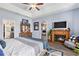 This is a gorgeous main bedroom that features a fireplace and a ceiling fan to keep you cool during the Summer at 227 Palm Terrace Loop, Conway, SC 29526