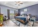 Cozy main bedroom with tray ceiling, a large window, and a relaxing, coordinated decor at 227 Palm Terrace Loop, Conway, SC 29526