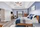 Inviting main bedroom featuring a tray ceiling, fireplace, and peaceful coordinated color scheme at 227 Palm Terrace Loop, Conway, SC 29526