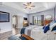 Bright main bedroom showcases an ensuite entrance, fireplace, and a cozy decorative scheme at 227 Palm Terrace Loop, Conway, SC 29526