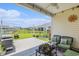 Covered back patio with beautiful outdoor furniture overlooking large backyard at 227 Palm Terrace Loop, Conway, SC 29526