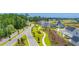 An aerial view of the community featuring a serene pond with a fountain and lush greenery, offering a peaceful setting at 2273 Hazel Way, Longs, SC 29568