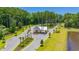 Aerial shot of the private community entrance surrounded by lush greenery and manicured landscaping at 2273 Hazel Way, Longs, SC 29568