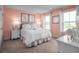 Charming bedroom with soft, pastel colors, decorative artwork, and plush bedding, offering a serene and inviting space at 2273 Hazel Way, Longs, SC 29568