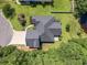 An aerial view of the house showcasing the roof, driveway, and landscaped yard at 229 Duchess Ct., Myrtle Beach, SC 29588