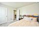 Bedroom with light brown bedding, carpet, and view to another room at 2325 Copper Creek Loop, Longs, SC 29568