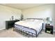 Cozy bedroom with minimal decor, a black dresser, and a comfortable bed at 2325 Copper Creek Loop, Longs, SC 29568