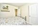 Cozy bedroom with floral bedding, carpet, and door to another room at 2325 Copper Creek Loop, Longs, SC 29568