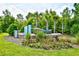 Welcoming community entrance sign surrounded by lush landscaping at 2325 Copper Creek Loop, Longs, SC 29568