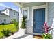 Inviting front door with stylish details and colorful potted plants at 2325 Copper Creek Loop, Longs, SC 29568