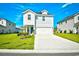 Charming two-story home with a manicured lawn and a two-car garage at 2325 Copper Creek Loop, Longs, SC 29568