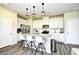 Modern kitchen with white cabinets, granite countertops, and stainless steel appliances and a kitchen island at 2325 Copper Creek Loop, Longs, SC 29568