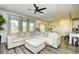 Spacious living room with modern ceiling fan, plush sectional, and plenty of natural light at 2325 Copper Creek Loop, Longs, SC 29568