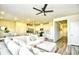 Open-concept living room with a large sectional, dining area, and modern kitchen at 2325 Copper Creek Loop, Longs, SC 29568