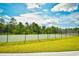 Community tennis court with high fences and well-maintained grounds at 2325 Copper Creek Loop, Longs, SC 29568