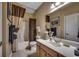 Bathroom with a vanity, mirror, and a shower/tub combination with a curtain at 2450 Marsh Glen Dr. # 112, North Myrtle Beach, SC 29582
