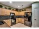Kitchen showcasing maple cabinets, tile backsplash, granite countertops, and stainless steel appliances at 2450 Marsh Glen Dr. # 112, North Myrtle Beach, SC 29582