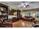 Bright living room featuring a large TV, built-in shelving, and cozy seating at 2450 Marsh Glen Dr. # 112, North Myrtle Beach, SC 29582