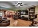 Living room with built-in shelving, large TV, hardwood floors, and comfortable seating at 2450 Marsh Glen Dr. # 112, North Myrtle Beach, SC 29582