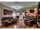 Comfortable seating in living room with an adjacent bar area and attractive hardwood flooring at 2450 Marsh Glen Dr. # 112, North Myrtle Beach, SC 29582