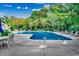 Community pool surrounded by lounge chairs, perfect for relaxation and recreation at 2450 Marsh Glen Dr. # 112, North Myrtle Beach, SC 29582