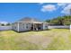 Expansive backyard featuring a well-maintained lawn and covered patio, perfect for outdoor entertaining at 2599 Woodcreek Ln., Conway, SC 29527