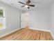 Bright bedroom features wood flooring, a ceiling fan, and a closet at 2599 Woodcreek Ln., Conway, SC 29527