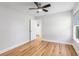 Bright bedroom features wood flooring, a ceiling fan, and a closet at 2599 Woodcreek Ln., Conway, SC 29527