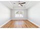 Spacious bedroom features a tray ceiling, fan, and large window at 2599 Woodcreek Ln., Conway, SC 29527