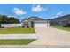 Charming single-story home with a well-manicured lawn and attached garage at 2599 Woodcreek Ln., Conway, SC 29527