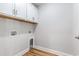 Laundry area with overhead cabinets and connections for appliances at 2599 Woodcreek Ln., Conway, SC 29527
