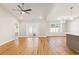 Bright living area with hardwood floors, recessed lighting, ceiling fan, and access to the outdoor patio at 2599 Woodcreek Ln., Conway, SC 29527