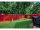 Backyard with lawn and red fence at 2602 Clearwater St., Myrtle Beach, SC 29579