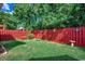 Backyard with lawn and red fence at 2602 Clearwater St., Myrtle Beach, SC 29579