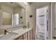 Well-lit bathroom showcasing double sinks, cabinets, and a glass-enclosed shower at 2602 Clearwater St., Myrtle Beach, SC 29579