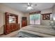 Cozy bedroom features a ceiling fan, window with blinds, a queen size bed and dresser at 2602 Clearwater St., Myrtle Beach, SC 29579