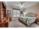 Comfortable bedroom with ceiling fan, window, queen size bed, and a dresser at 2602 Clearwater St., Myrtle Beach, SC 29579