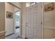 Bright foyer with white door, neutral walls, and views into the adjacent living area at 2602 Clearwater St., Myrtle Beach, SC 29579
