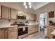 Bright kitchen showcasing modern appliances, neutral cabinetry, and a functional layout at 2602 Clearwater St., Myrtle Beach, SC 29579