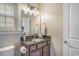 Bathroom vanity with granite countertop, modern lighting, and vanity storage at 2701 Kashton Dr., Myrtle Beach, SC 29577